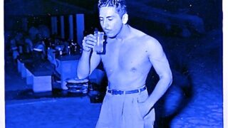 Shirtless Man Drinking
