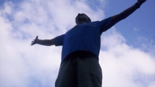 open arms looking up to the sky