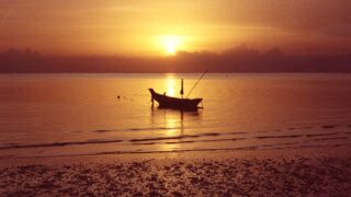 Sunset and alone boat