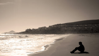 alone and sad man sitting