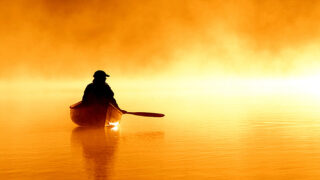 boat alone yellow fog