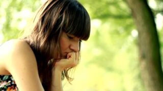 young sad lonely beautiful woman