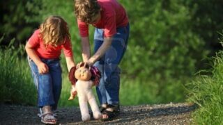 boy and girld with doll