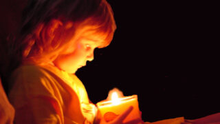 child and candle