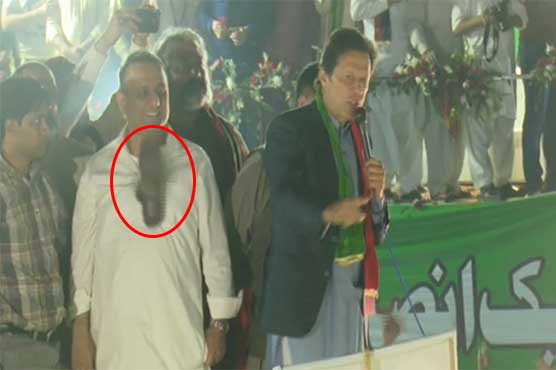 Attempting to throw shoe at Imran Khan